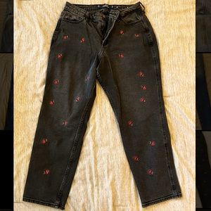 Hollister black jeans with small embroidered roses.